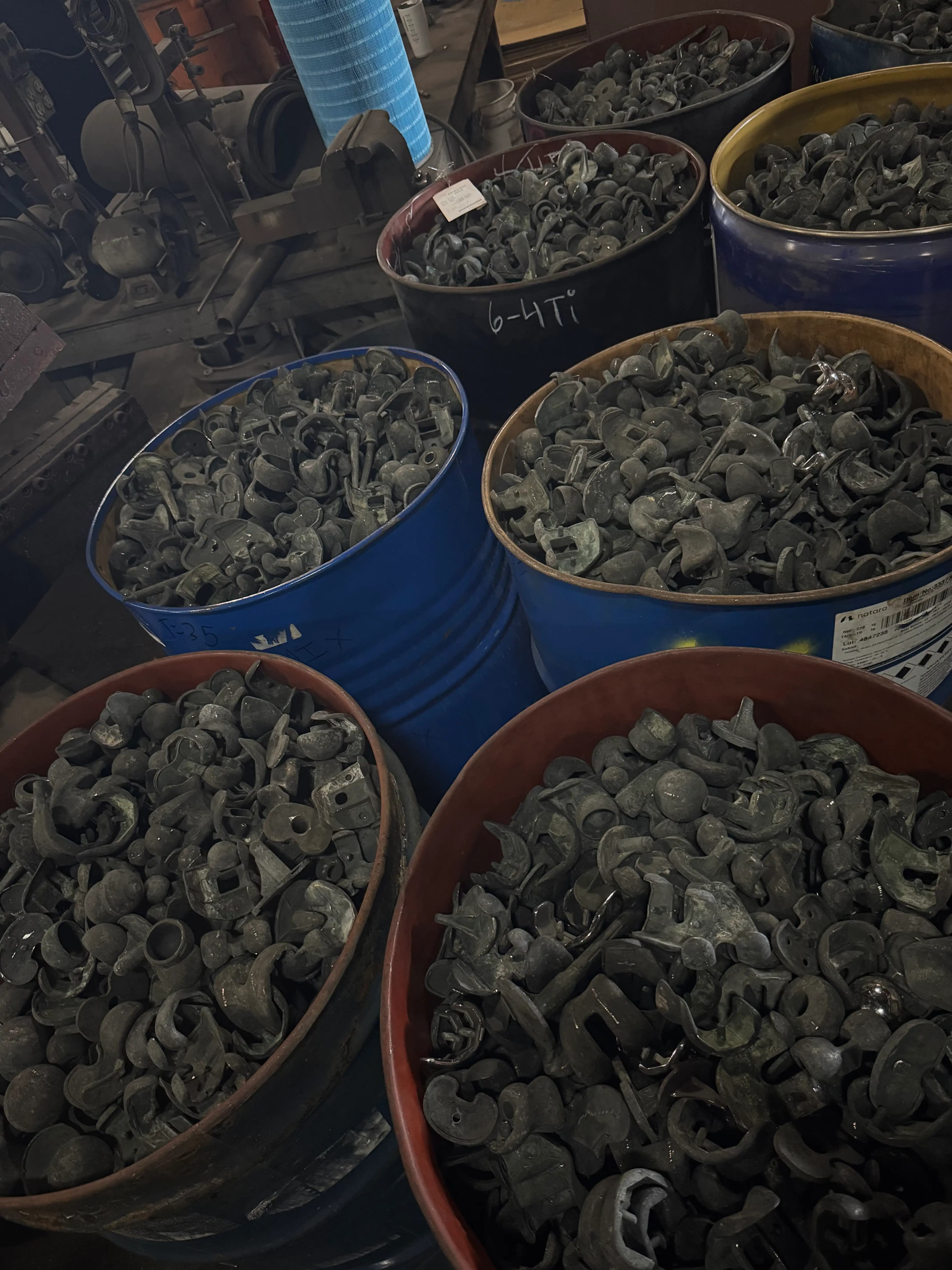 Recovered tungsten carbide parts in industrial drums